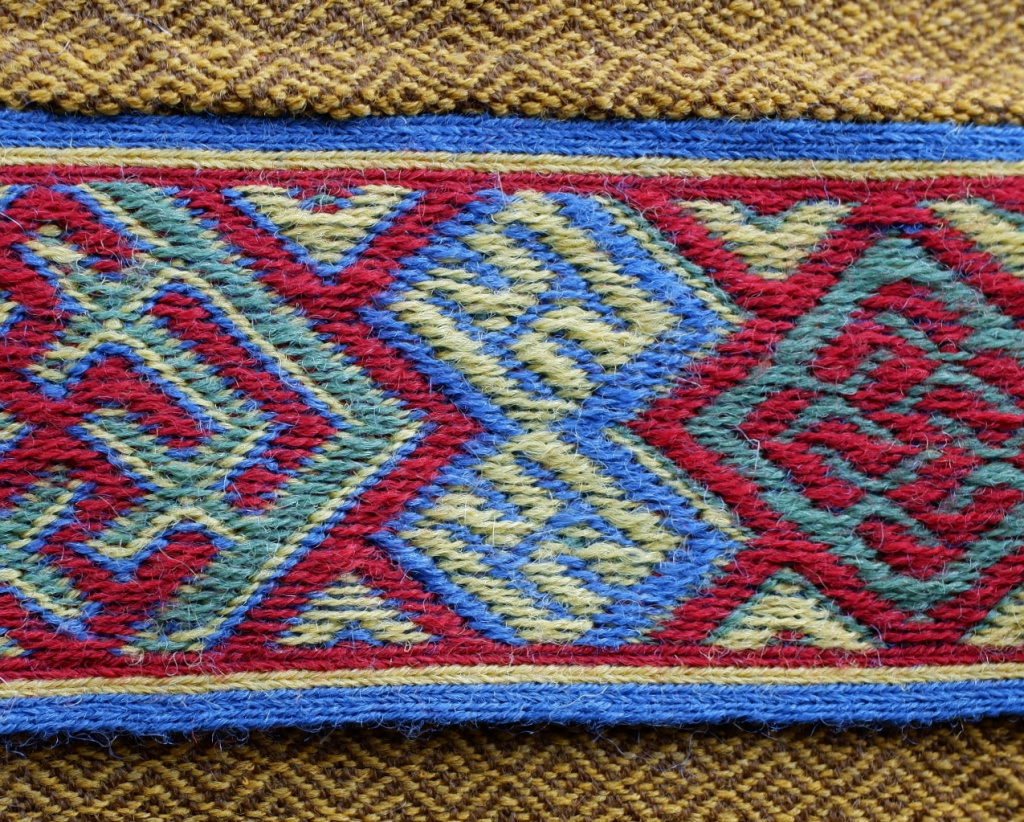 Figure 2: A weaving of three figures from Snartemo V. Photo: Author.  